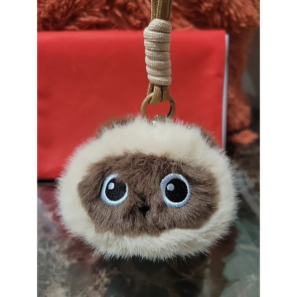 NOB.Siamese cat plush keychain, often identified as a "Duoai" brand.